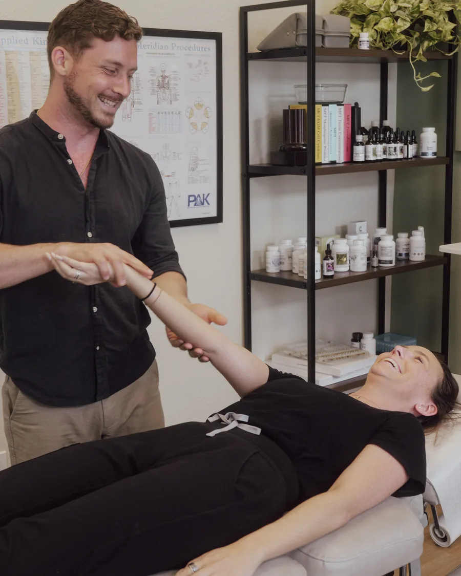 Applied kinesiology arm muscle test with Dr. Jarod Ward at Crown Chiropractic, Fort Myers