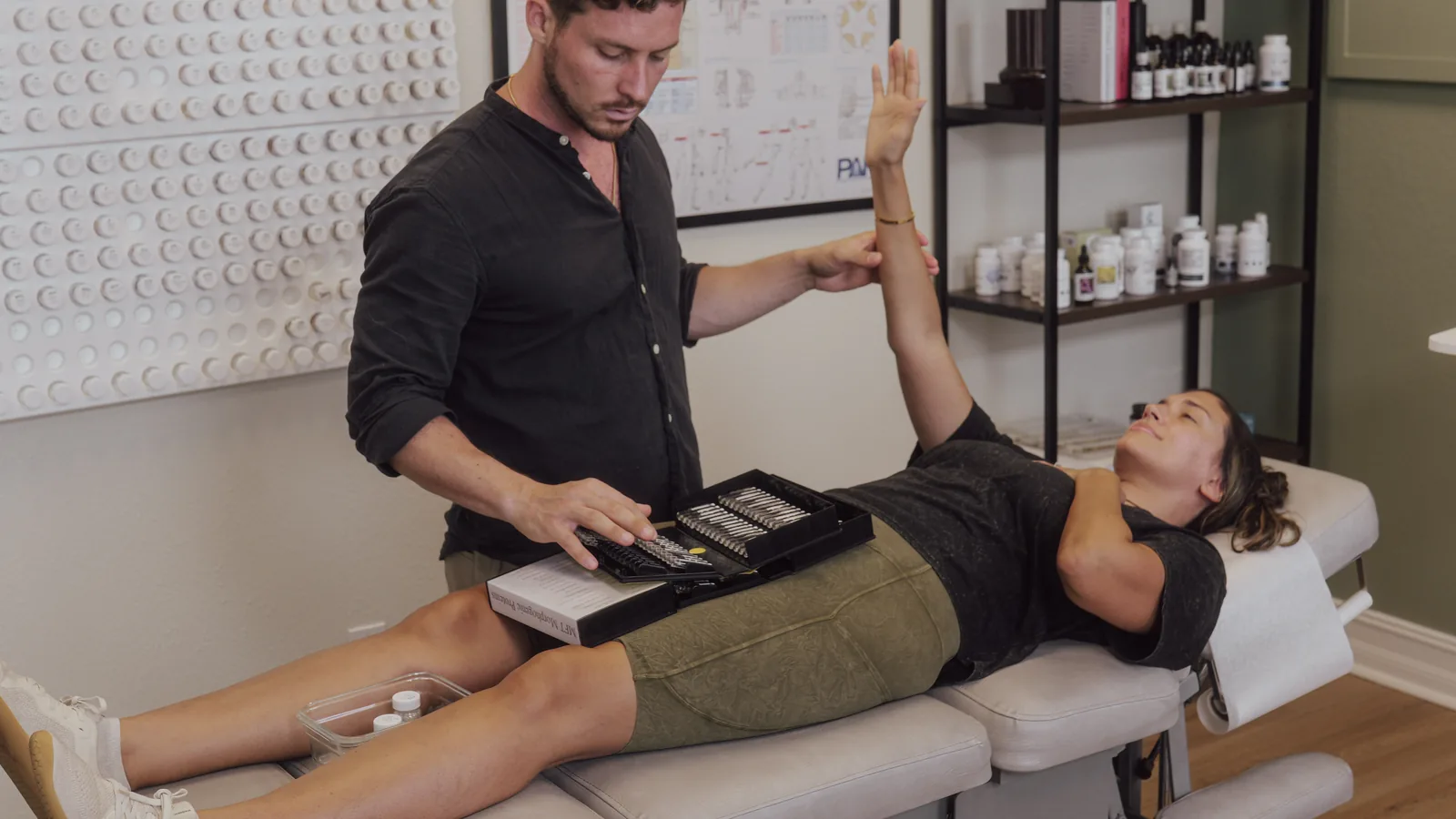 Dr. Jarod Ward performing Nutrition Response Testing at Crown Chiropractic in Fort Myers, FL