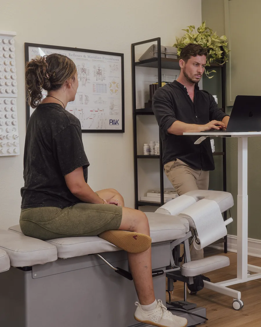 Dr. Jarod Ward reviewing Nutrition Response Testing results with a patient in Fort Myers